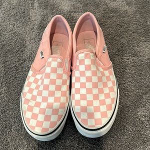 Woman’s pink checkered vans